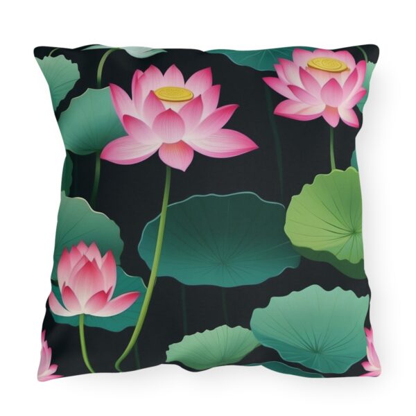 outdoor pillow featuring pink lotus flowers with green leaves on a black background