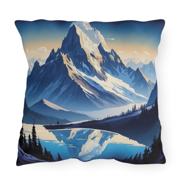 outdoor pillow featuring a majestic snow-capped mountain peak reflected in a serene lake with a forest in the foreground