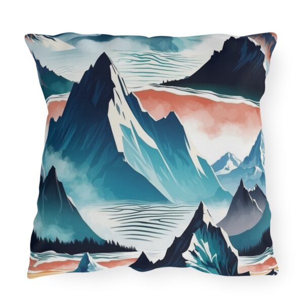 outdoor pillow featuring an abstract design of mountain peaks in shades of blue and white