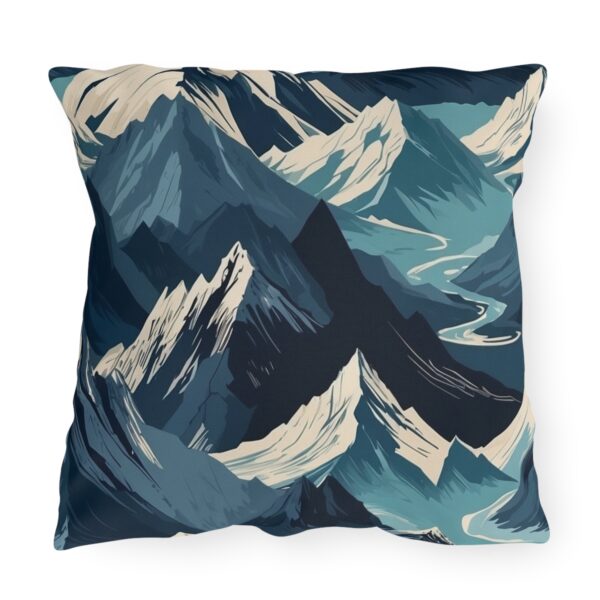 outdoor pillow featuring an abstract design of mountain peaks in shades of blue and white