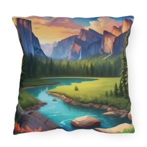 Outdoor pillow featuring a serene national park landscape with mountains, a river, and trees at sunset.