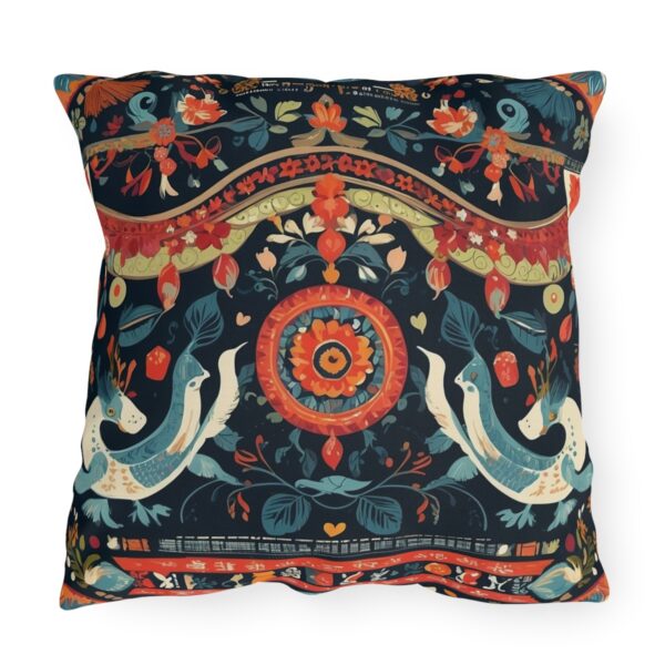 Outdoor pillow with detailed cultural patterns and textiles in vibrant colors on a dark background.