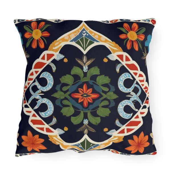 Outdoor pillow with colorful traditional patterns and textiles from various cultures on a dark background.