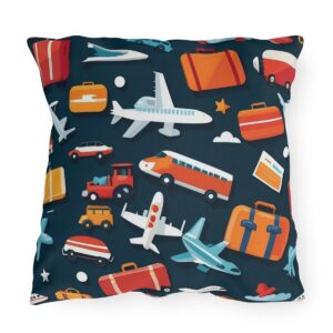 Outdoor pillow with colorful travel icons like airplanes, buses, and luggage on a dark blue background.