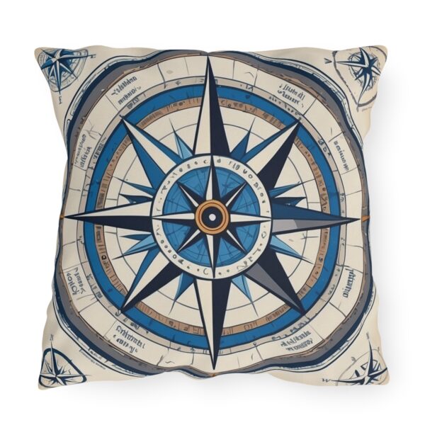 Outdoor pillow with a blue and beige compass design featuring global coordinates