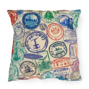 Outdoor pillow with colorful passport stamps design on cream background