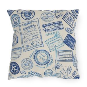 Outdoor pillow with blue passport stamps design on cream background