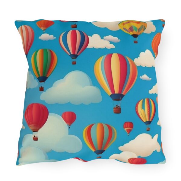 Outdoor pillow with colorful hot air balloons and clouds design