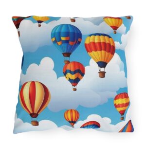 Outdoor pillow with colorful hot air balloons floating in blue sky