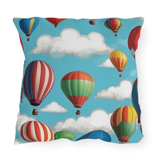 Outdoor pillow with colorful hot air balloons and clouds design