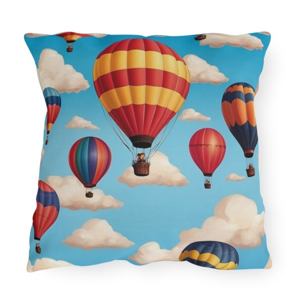 Outdoor pillow with red and yellow hot air balloons design