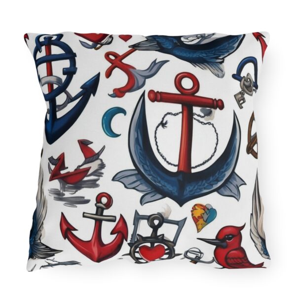 Outdoor pillow with white background featuring red and blue anchors and nautical symbols