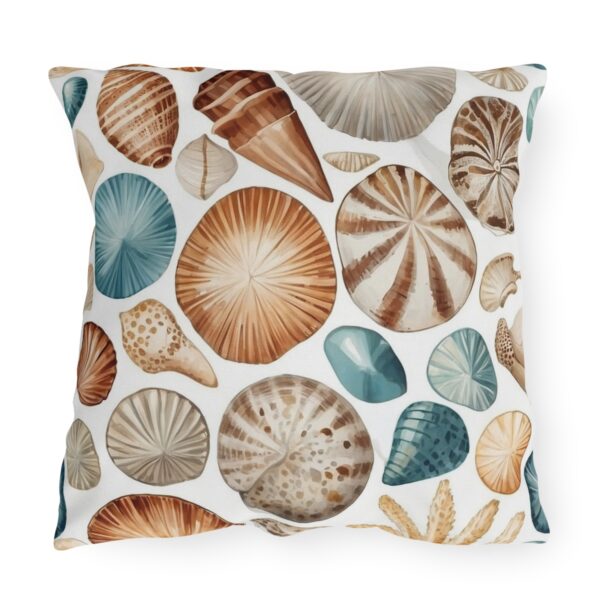 Outdoor pillow with white background and assorted seashell design