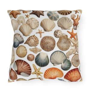 Outdoor pillow with white background and assorted seashell and starfish design