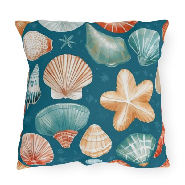 Outdoor pillow with teal background and colorful seashell and starfish design