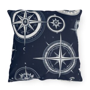 Outdoor pillow with dark navy background and white nautical compass design