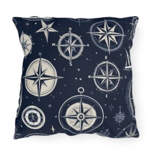 Outdoor pillow with navy background and ivory nautical compass design