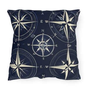 Outdoor pillow with dark navy background and ivory nautical compass design