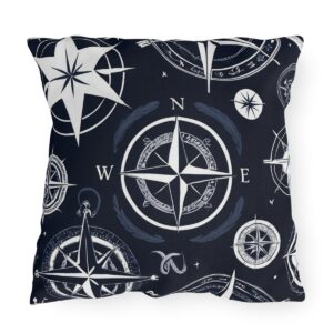 outdoor pillow featuring white compass designs on a dark blue background