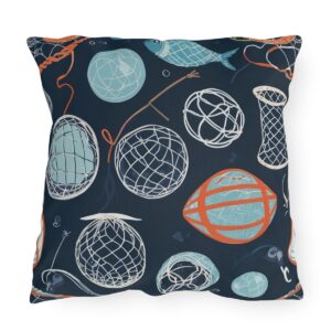 Outdoor pillow featuring a dark blue background with fishing nets, buoys, and ropes in light blue and orange accents