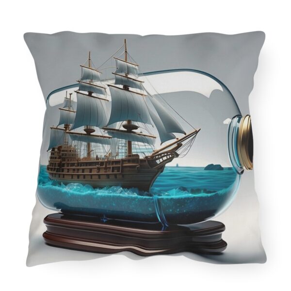 outdoor pillow featuring a ship in a bottle with detailed sails and blue ocean inside