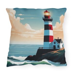 outdoor pillow featuring a red and white lighthouse on a rocky shore with ocean waves and a glowing light