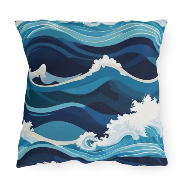 outdoor pillow featuring stylized ocean waves in various shades of blue and white