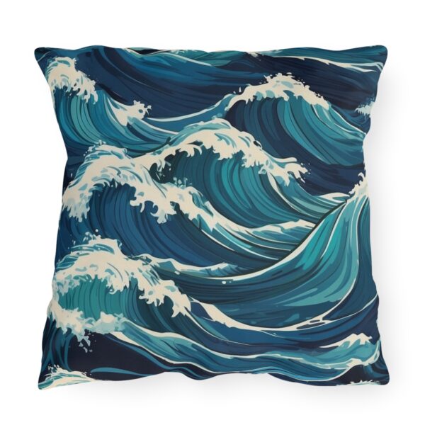 outdoor pillow featuring large crashing ocean waves in vibrant blue and white tones