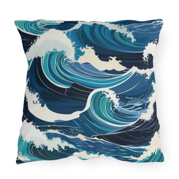 outdoor pillow featuring bold crashing ocean waves in shades of blue and white