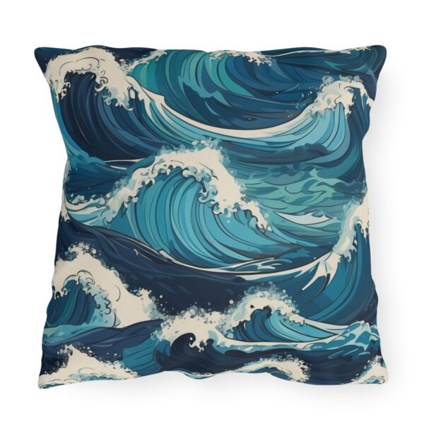 outdoor pillow featuring large crashing ocean waves in shades of blue and white