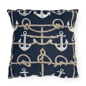 outdoor pillow featuring white anchors and beige ropes on a navy blue background