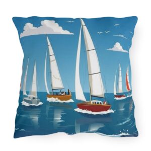 outdoor pillow featuring sailboats with white sails on a calm ocean under a blue sky with clouds