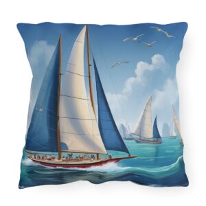 outdoor pillow featuring sailboats with white and blue sails on the ocean with a cloudy sky and seagulls