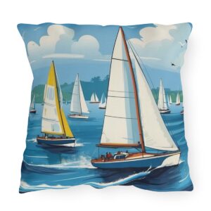 outdoor pillow featuring sailboats with white and yellow sails on a blue ocean under a cloudy sky