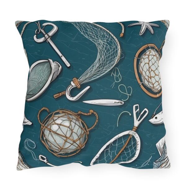 Outdoor pillow with a teal background featuring fishing nets, anchors, ropes, and nautical tools