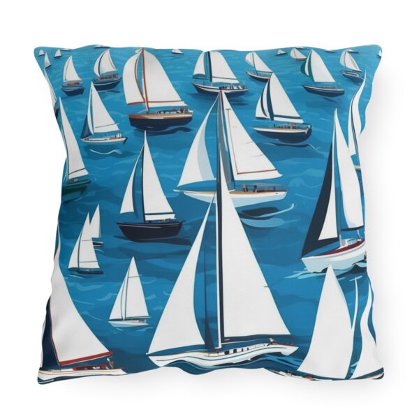 outdoor pillow featuring numerous sailboats with white sails on a blue ocean background