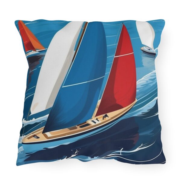 outdoor pillow featuring colorful sailboats with blue, red, and white sails on the ocean