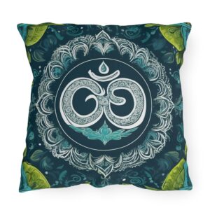 Outdoor pillow with a design featuring the sacred Om symbol in white on a dark green background with intricate floral patterns and green accents.