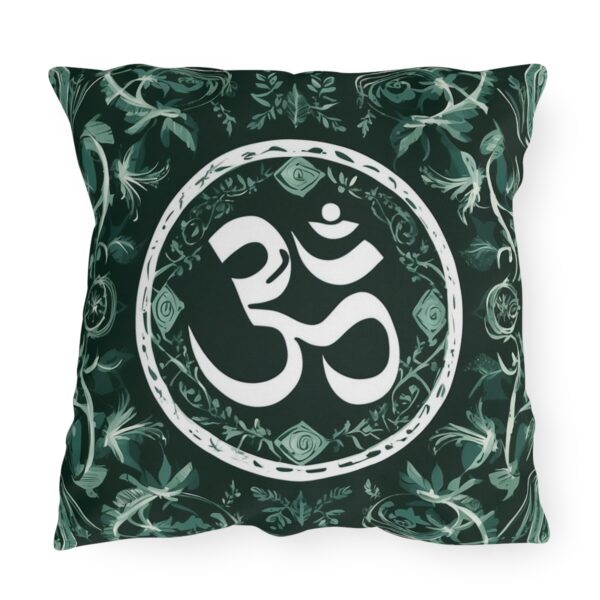 Alt Text: Outdoor pillow with a design featuring the sacred Om symbol in white on a dark green background with intricate patterns.