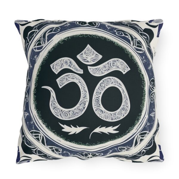 Outdoor pillow with a design featuring the sacred Om symbol in intricate white patterns on a dark background.