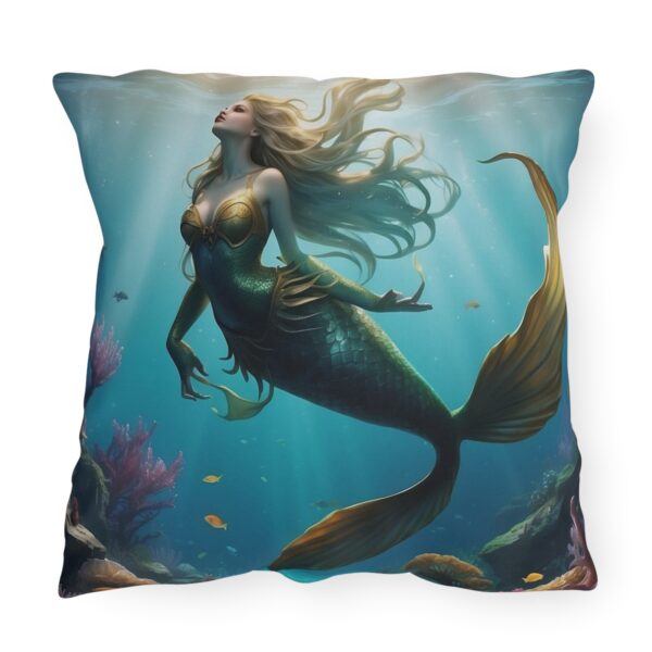 Outdoor pillow featuring an underwater scene with a majestic mermaid and colorful fish