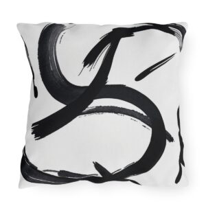 Outdoor pillow featuring abstract black Zen brush strokes on a white background