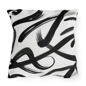 Outdoor pillow featuring abstract black Zen brush strokes on a white background