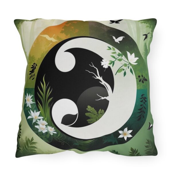 Outdoor pillow featuring a Yin Yang design with nature elements, including flowers, trees, and birds