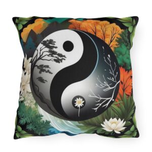 Outdoor pillow featuring a Yin Yang design with contrasting seasonal nature scenes and flowers