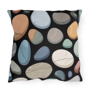 Outdoor pillow featuring a design of various colorful smooth stones on a black background