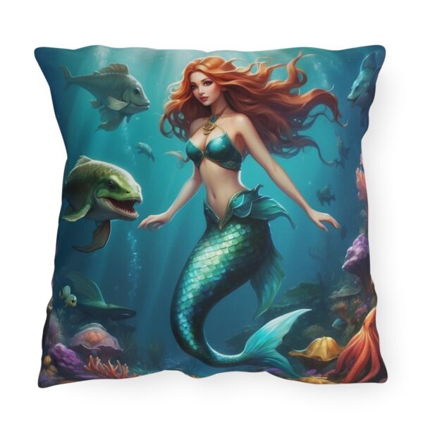 Outdoor pillow featuring an underwater scene with a beautiful mermaid, fish, and coral reefs