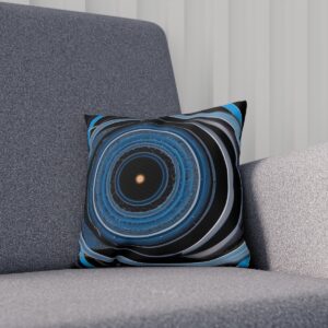 Cushion with blue-toned orbital rings on dark gray chair