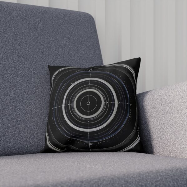 Black and white orbital rings cushion on gray chair