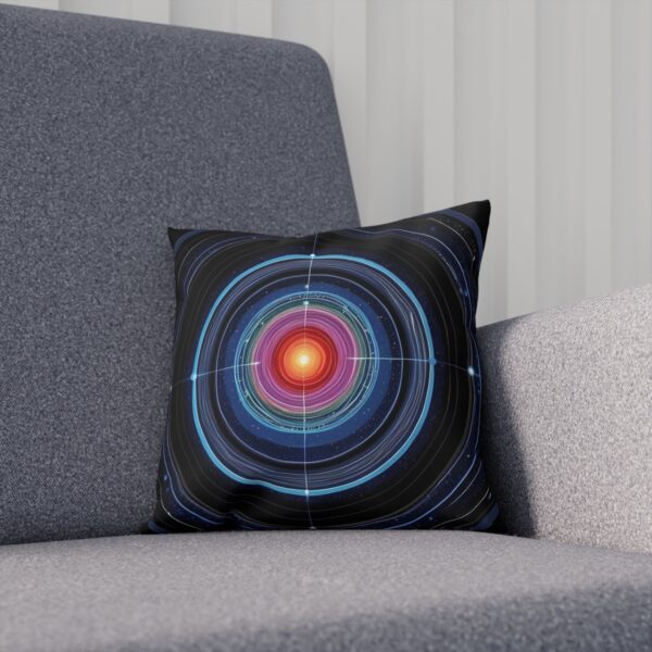 Cushion with colorful orbital ring pattern on dark gray chair